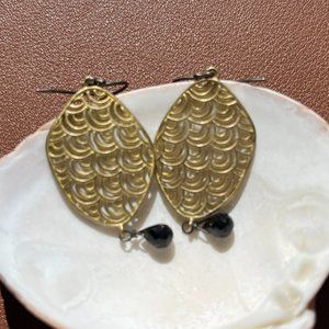 Gold earrings with black stones